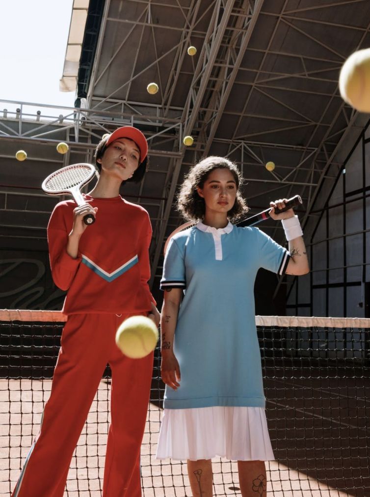 two_ladies_with_tennis_rocket_and_balls